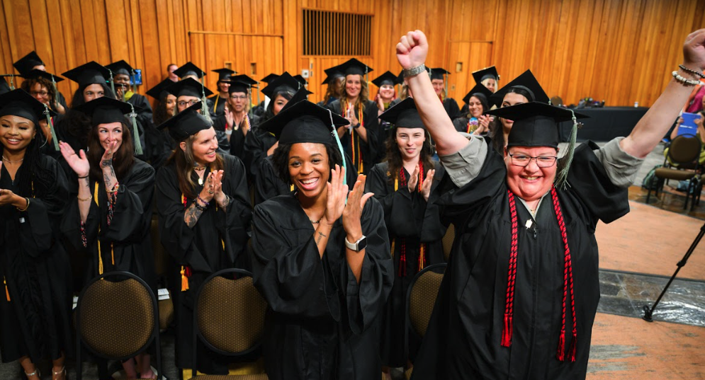 graduates celebrating their completion of their studies at a holistic health college