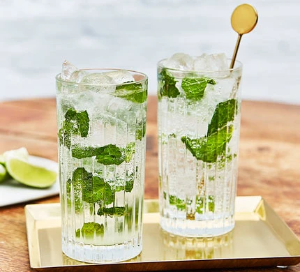 A picture of a glass of mojito, perfect for a board game party.