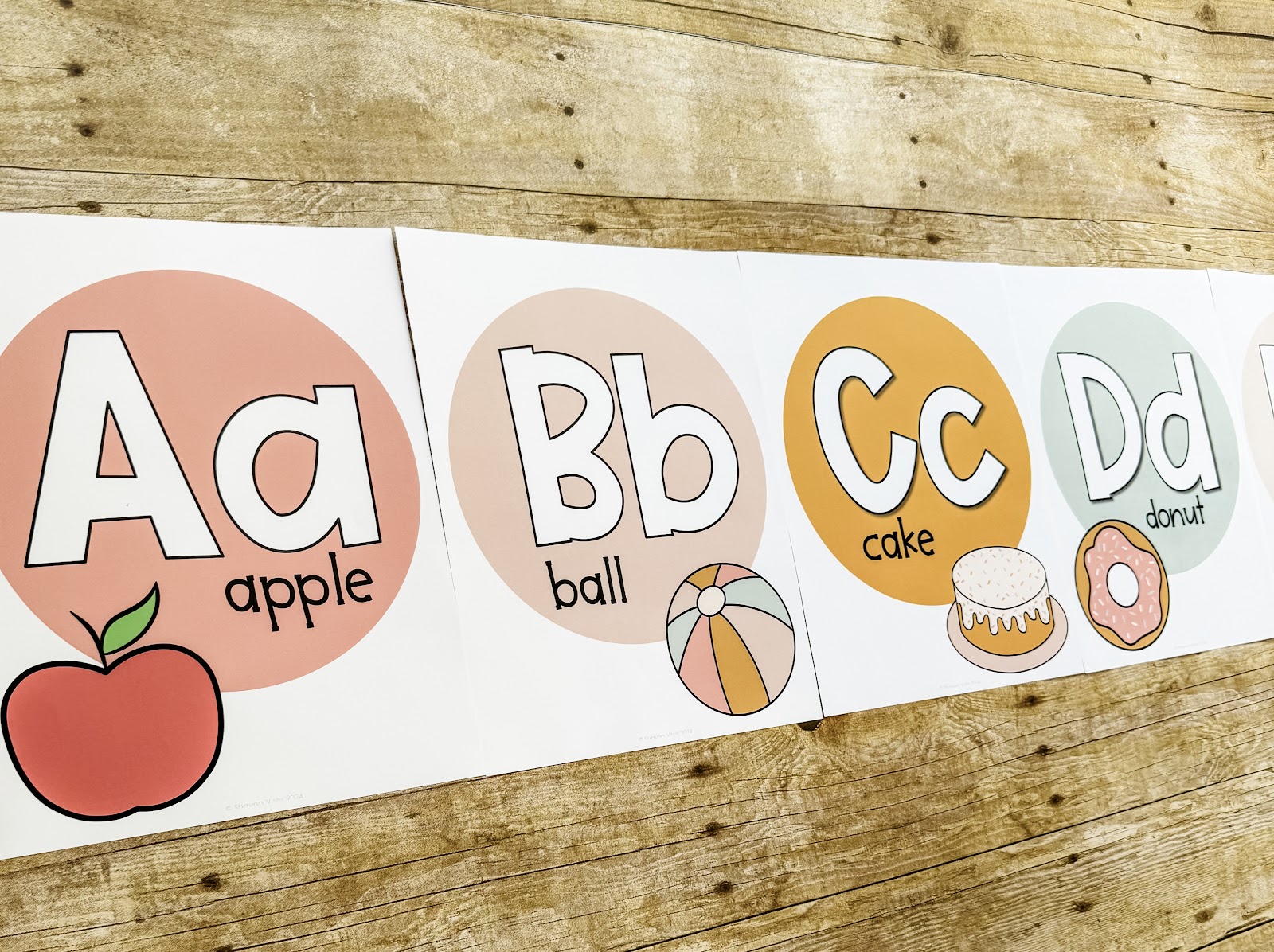 This image shows alphabet posters with the letters, a picture, and the word of the picture. 