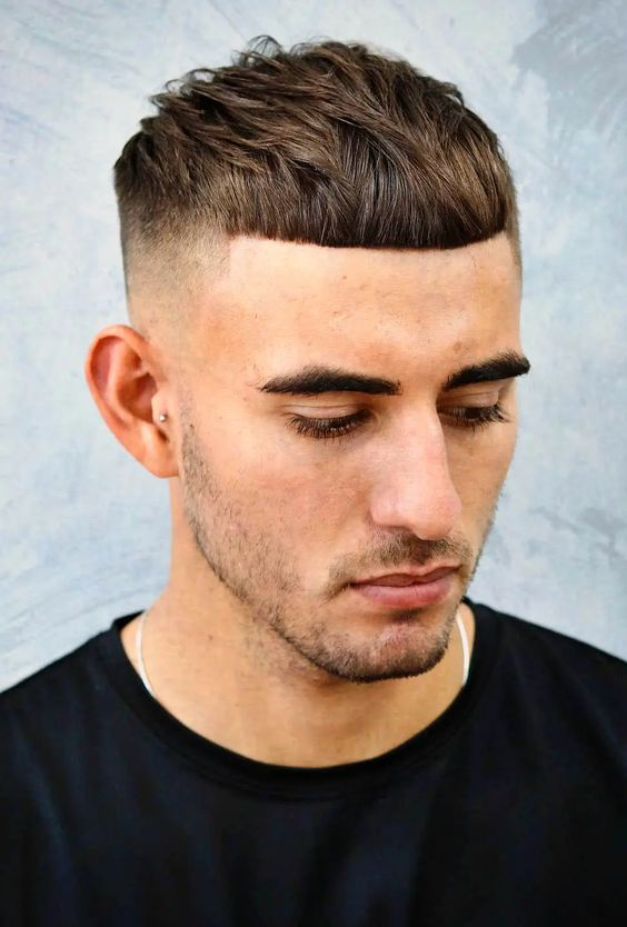 Full picture showing a man with the edgar haircut hairstyle