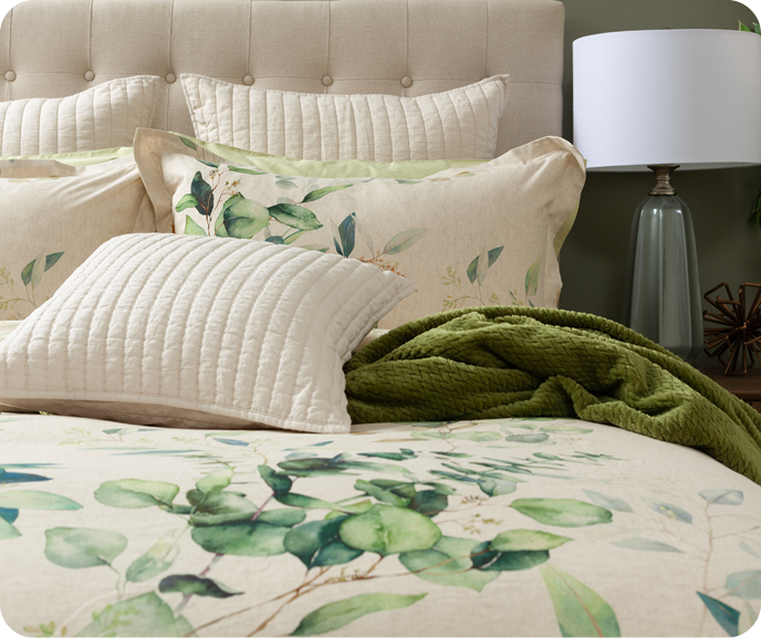 Our Botanical Duvet Cover Medlow shown on a bed styled with our green Chevron Plush Throw in Moss.