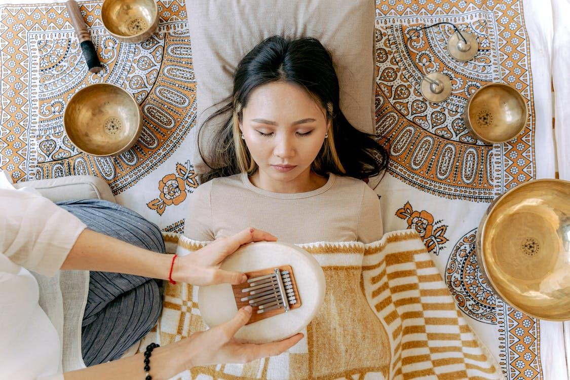 Free Woman Relaxing while Listening to Sounds Stock Photo