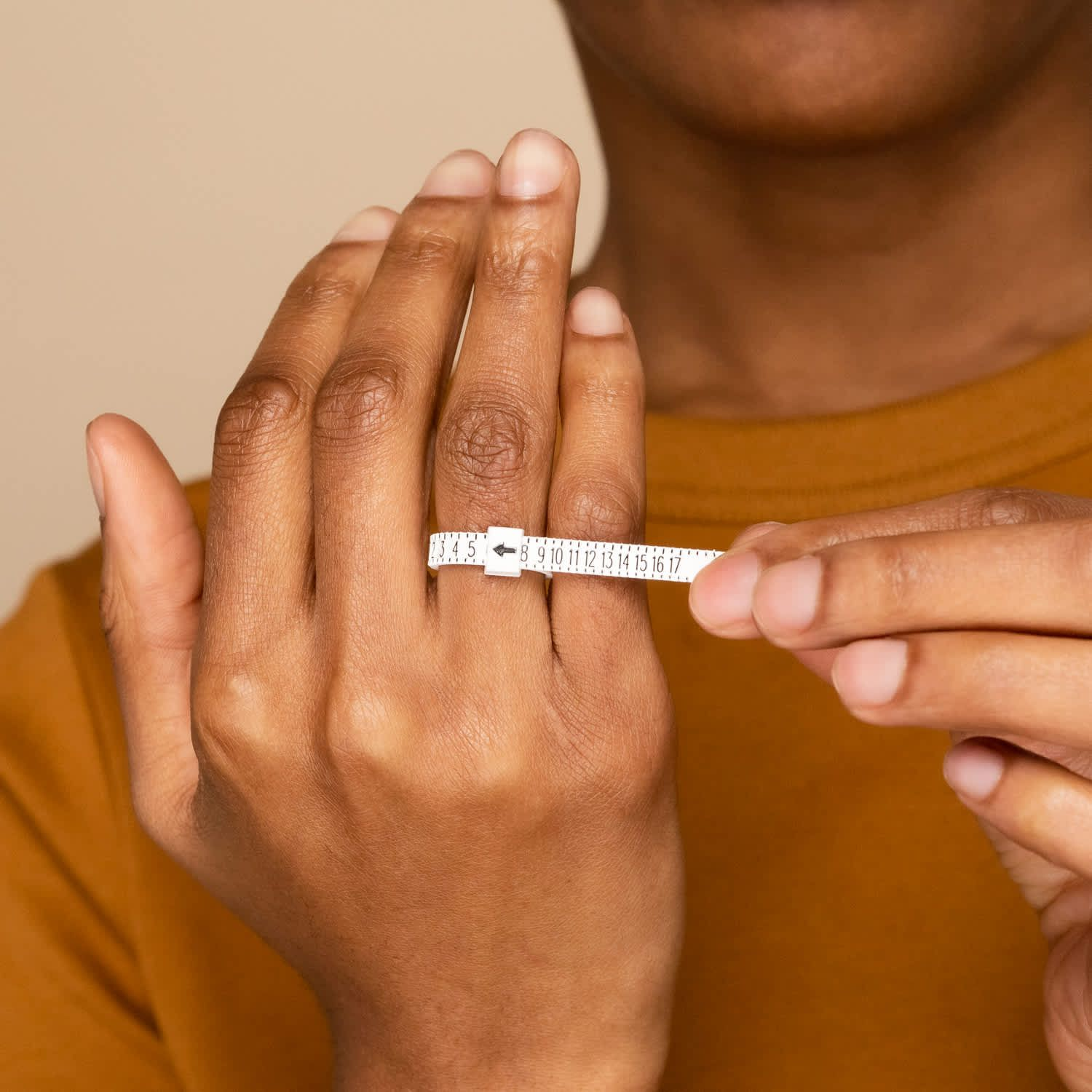 Picture of a lady trying to measure her ring size