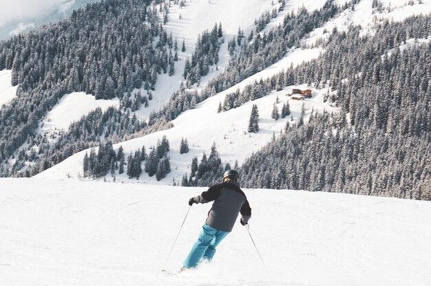 Free photo person skiing in the mountains