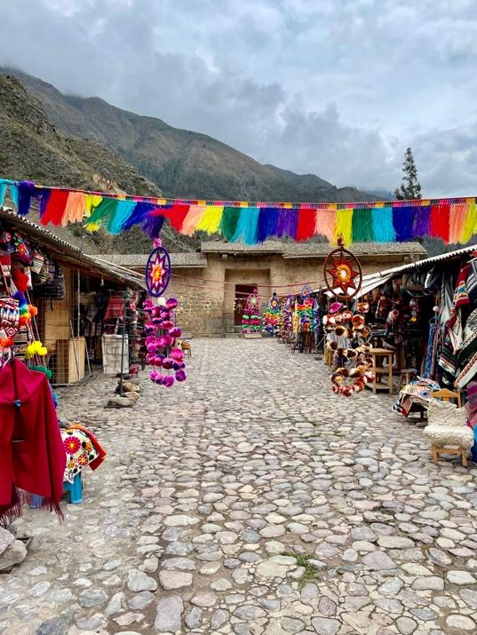 A street with colorful flags

Description automatically generated