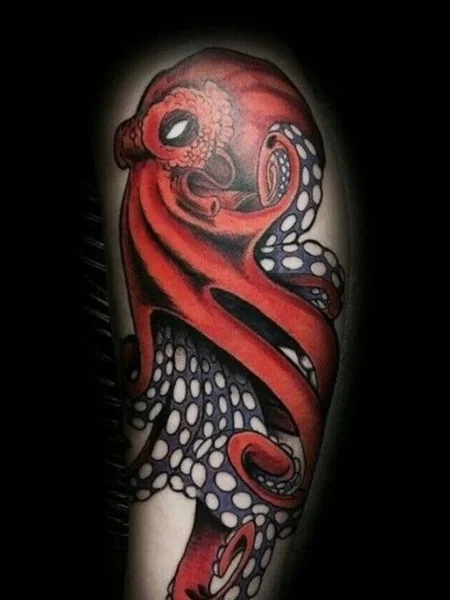 Picture showing the red colorful body art on the arm of someone