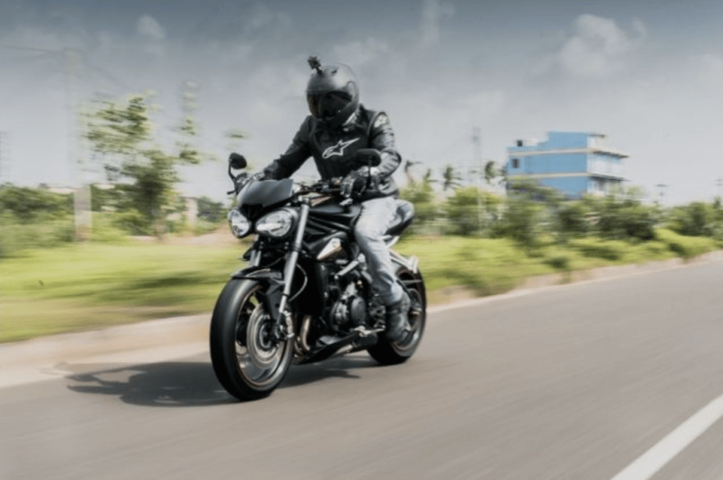 motorcyclist in florida riding down the road quickly