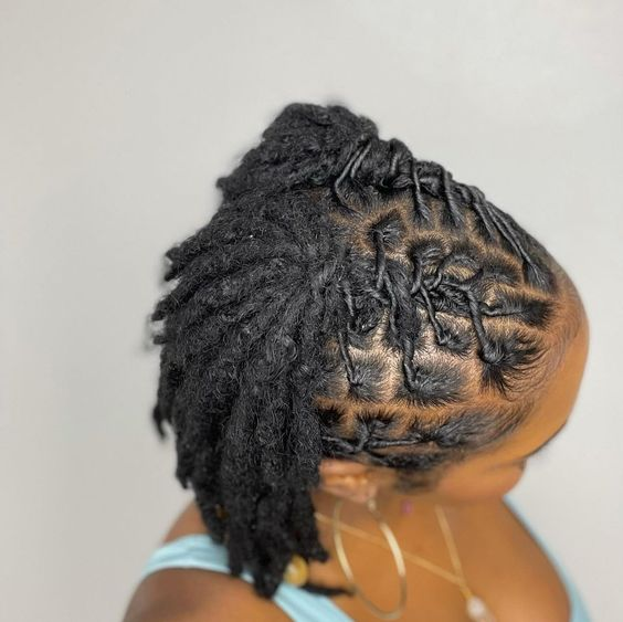 Picture showing a lady rocking  a gorgeous dreadlock style 