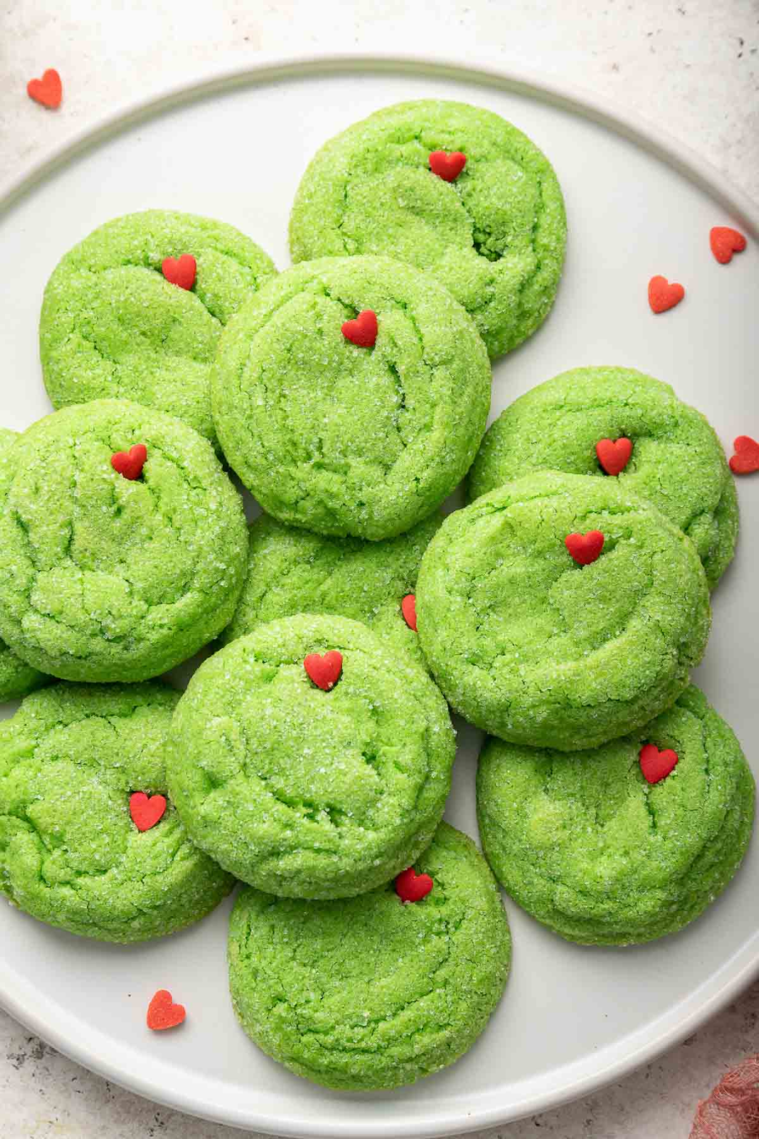 green sugar cookies with tiny red hearts