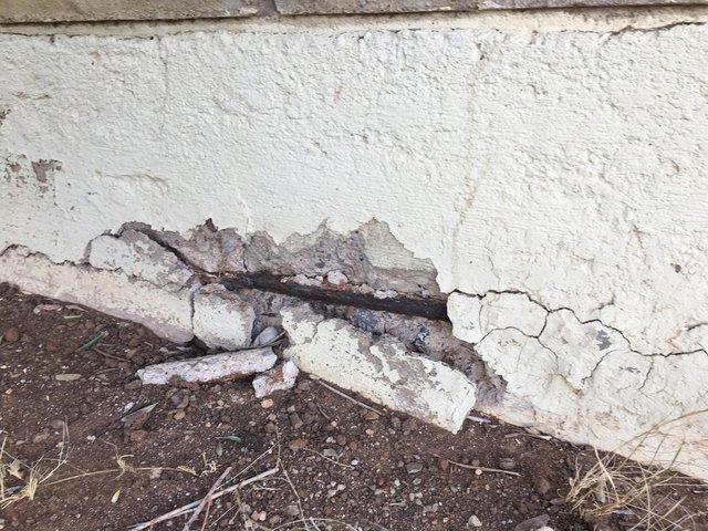 Crumbling Stem Wall with Rusting Rebar