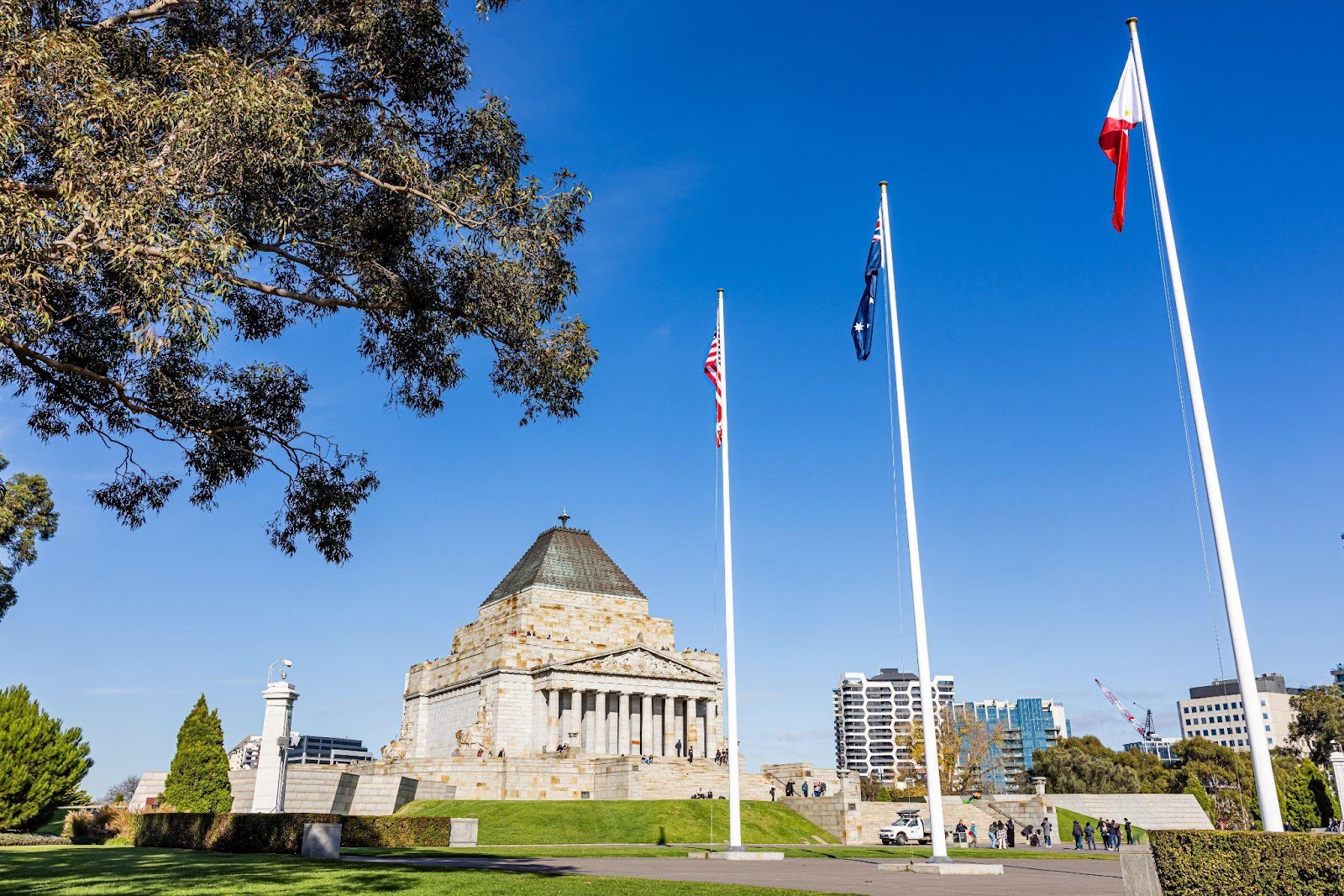 Flags in front of a buildingDescription automatically generated