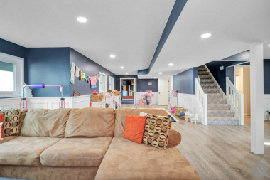 factors that affect the average cost to finish a basement living room with couch custom built michigan