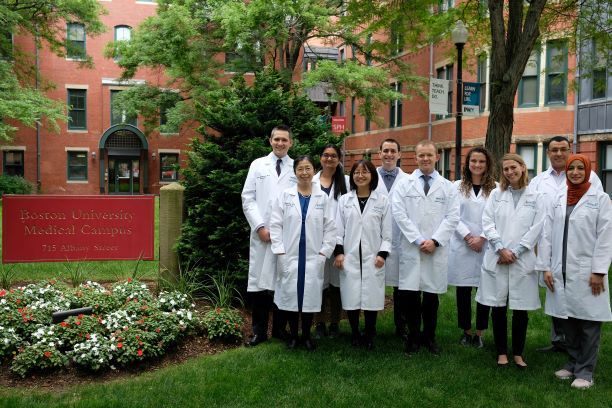 A group of medical students standing next to a sign for Boston University Medical Campus