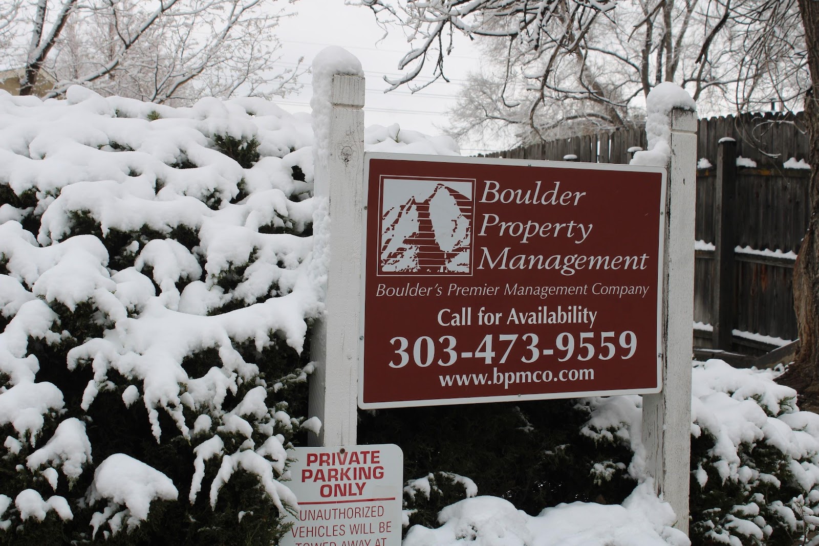 Boulder Property Management sign in the snow