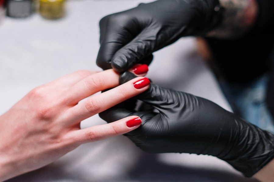 A technician working on fake nails