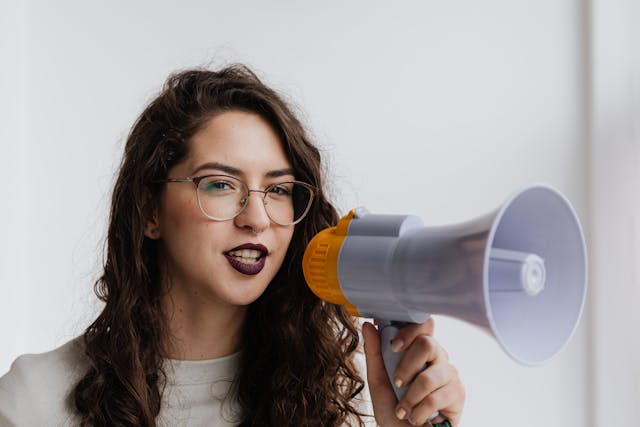 A woman holding a megaphone