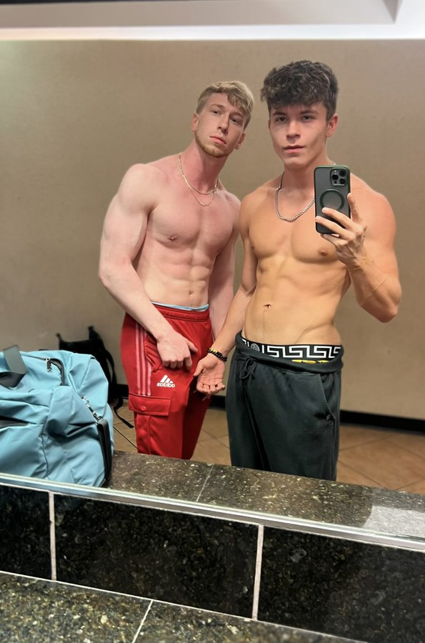 Jesse Stone standing shirtless with onlyfans content creator Drake Von