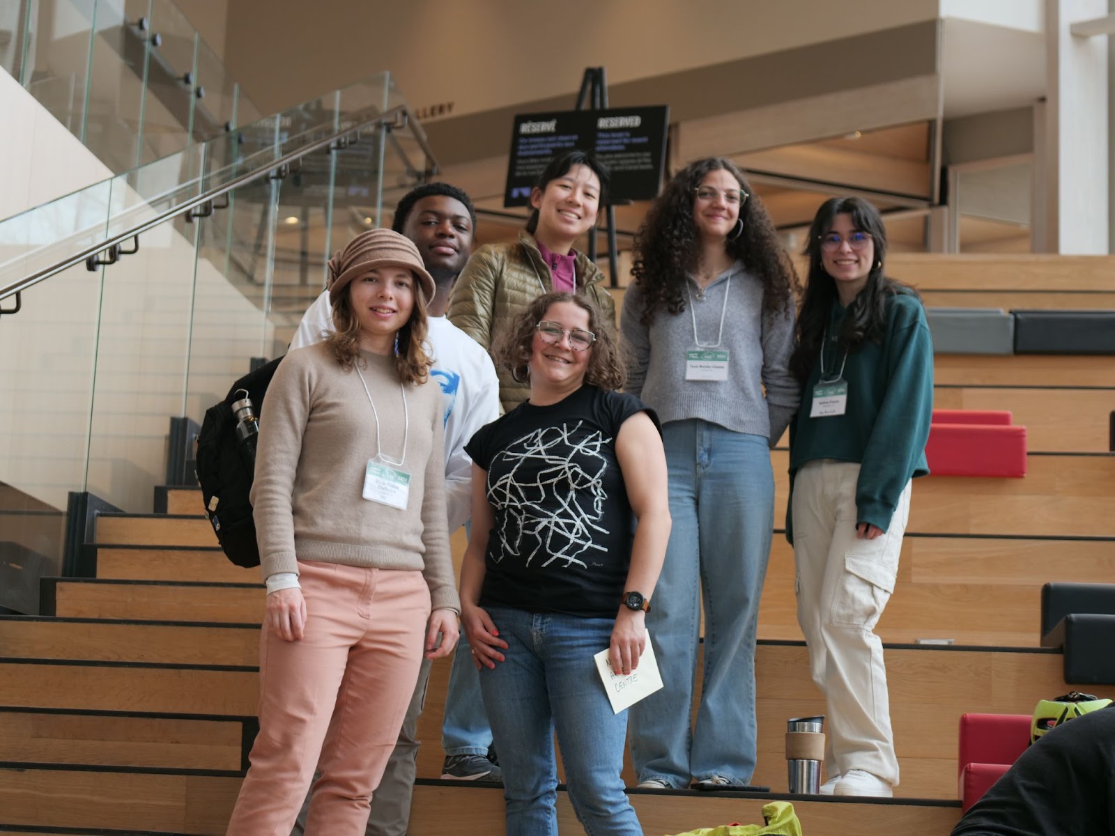 All smiles with poetry hunt creator Nina Drystek and students at her station at the National Arts Centre. 