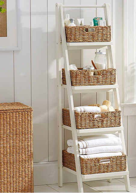 A shelf with baskets and towels

Description automatically generated