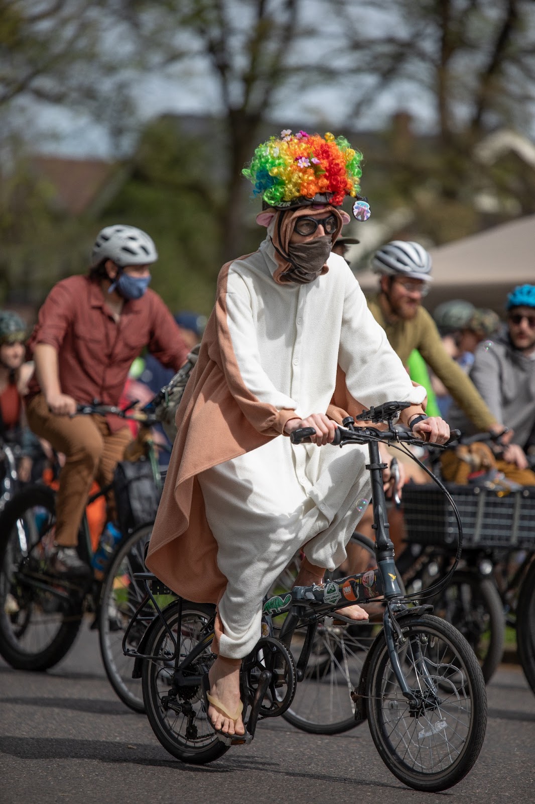 A rider in the Ladd's 500 wearing a really intense drop-crotch onesie type thing and a rainbow wig.