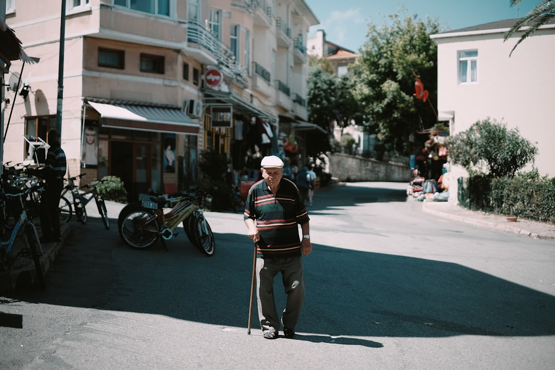 A senior person walking on the road