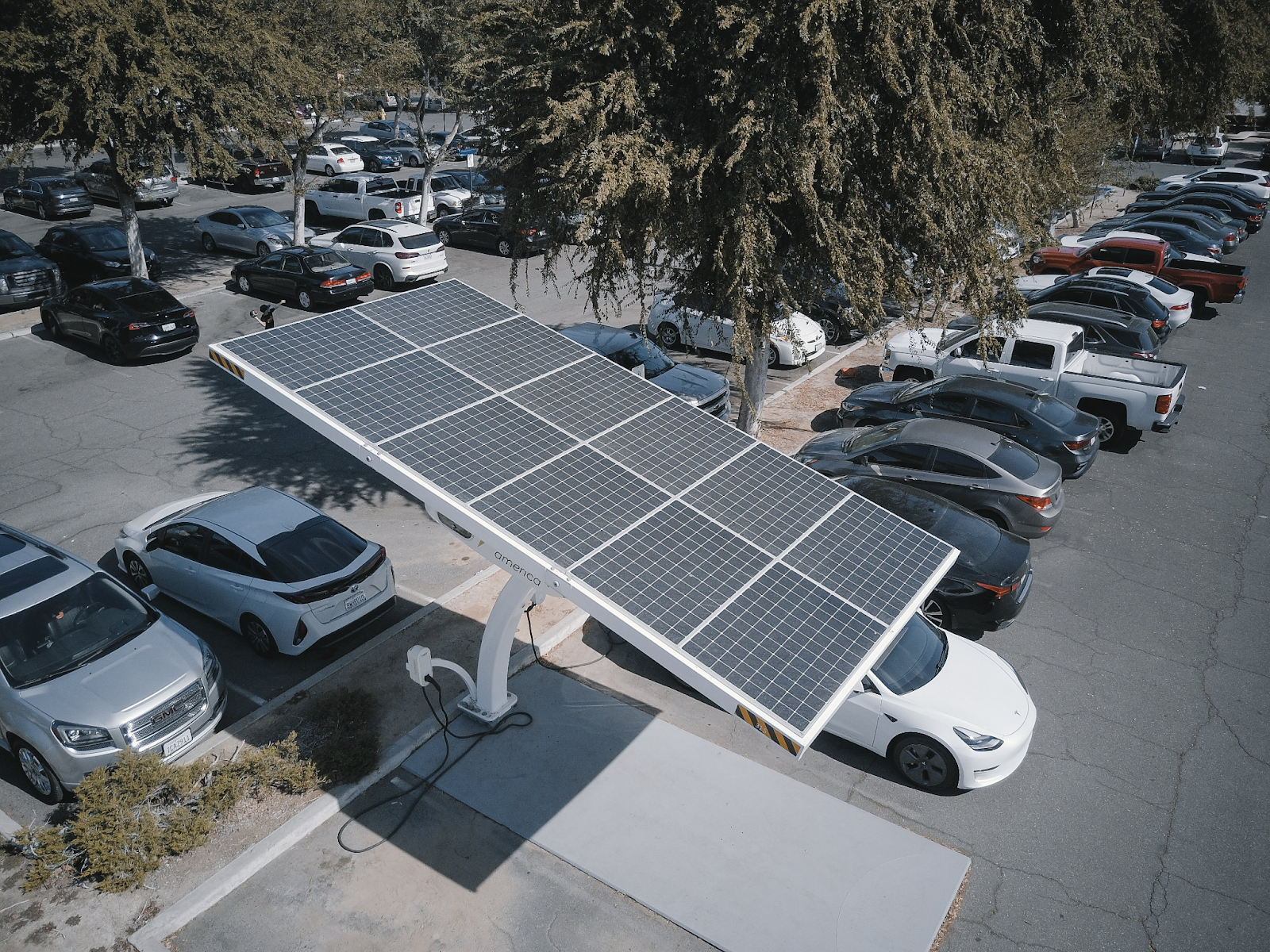 A fleet of solar-powered cars EV in a parking lot. 