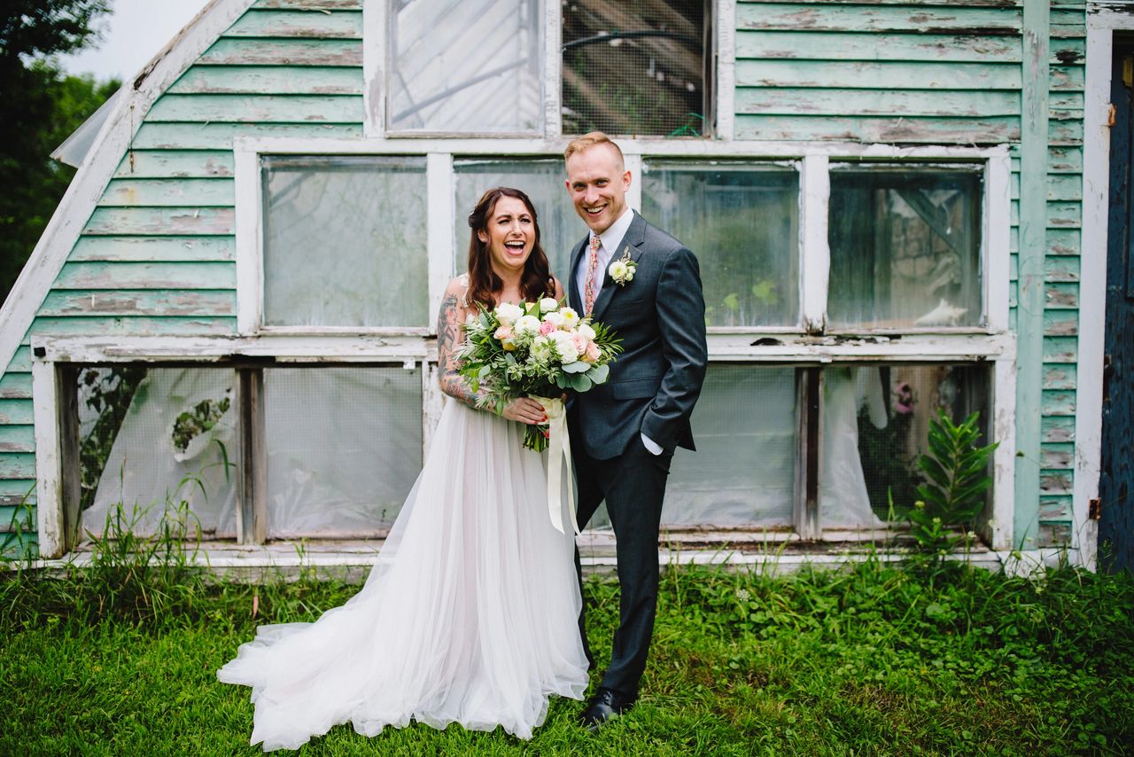 Bride and groom laughing together