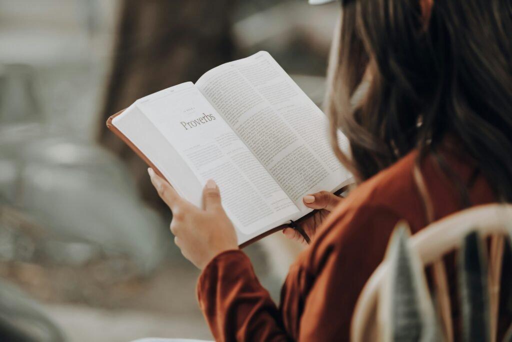 woman reading a book on proverbs - Effective Study Habits