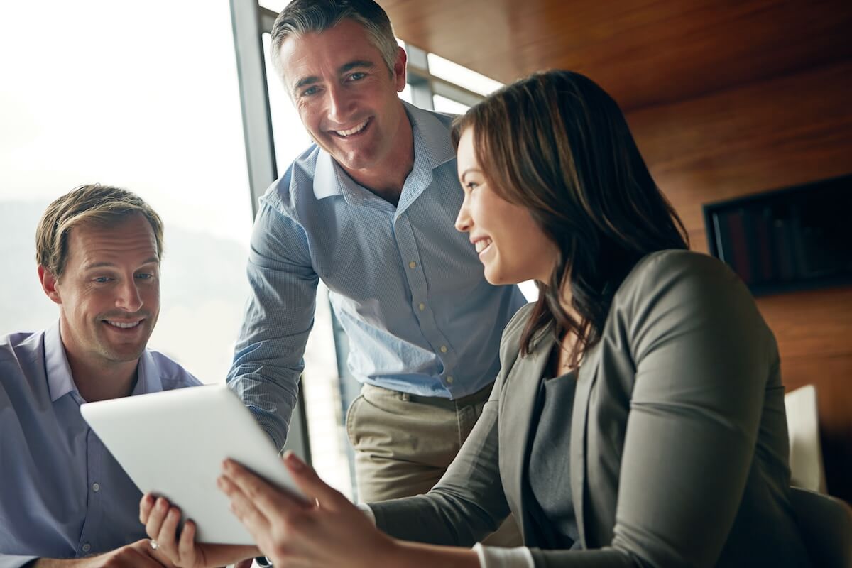 Entrepreneurs looking at a tablet