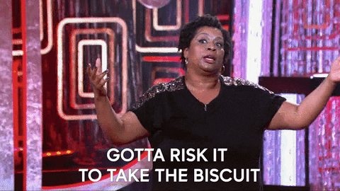 A GIF of a woman holding her hands out to an audience exclaiming 'gotta risk it for a biscuit'. 