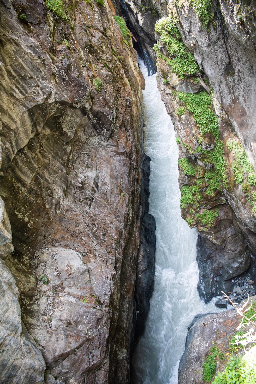 A person standing in a canyon

Description automatically generated