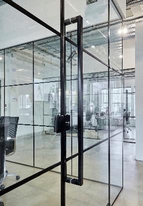 A glass wall with black metal rodsDescription automatically generated with medium confidence
