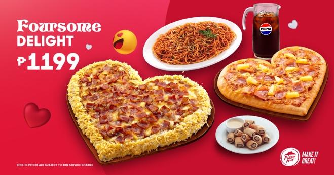 A heart shaped pizza and a drink

Description automatically generated