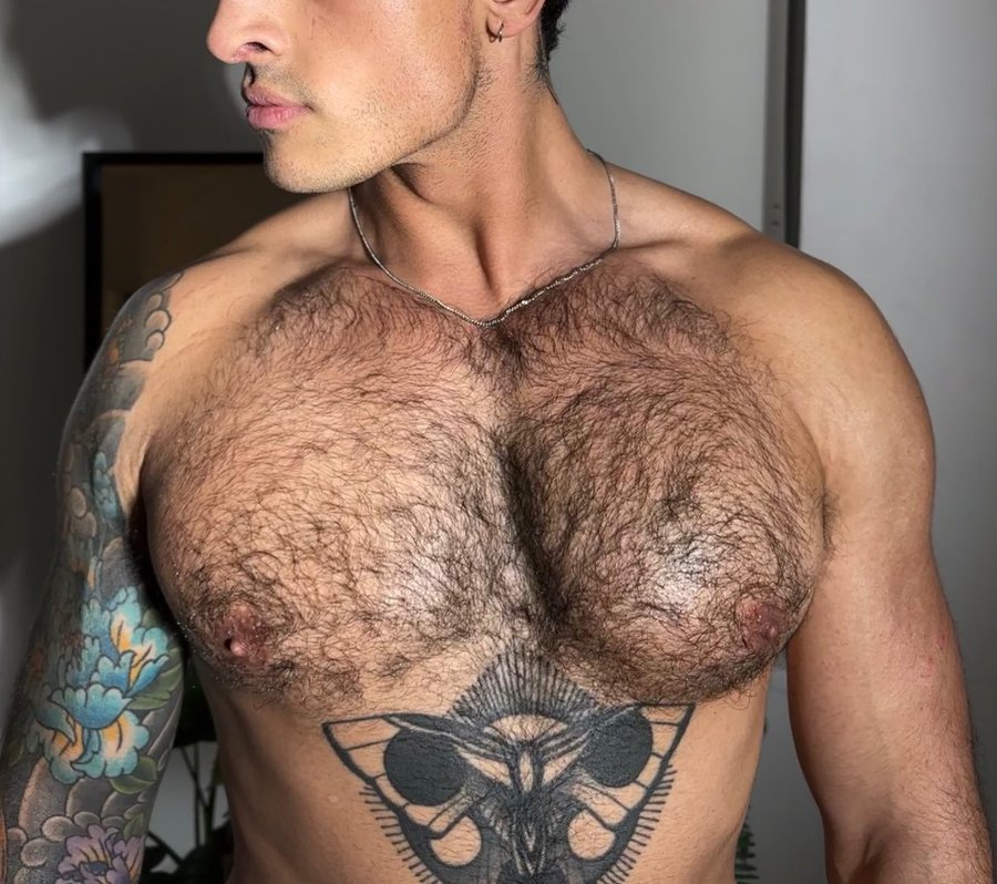 gay onlyfans creator Nick_at_Night showing off his gay hairy chest and chest tattoos in selfie