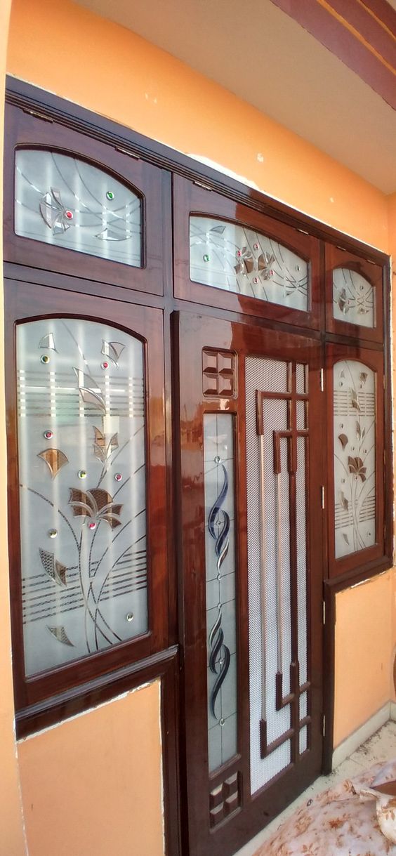 Designer glass-panelled teak main door design