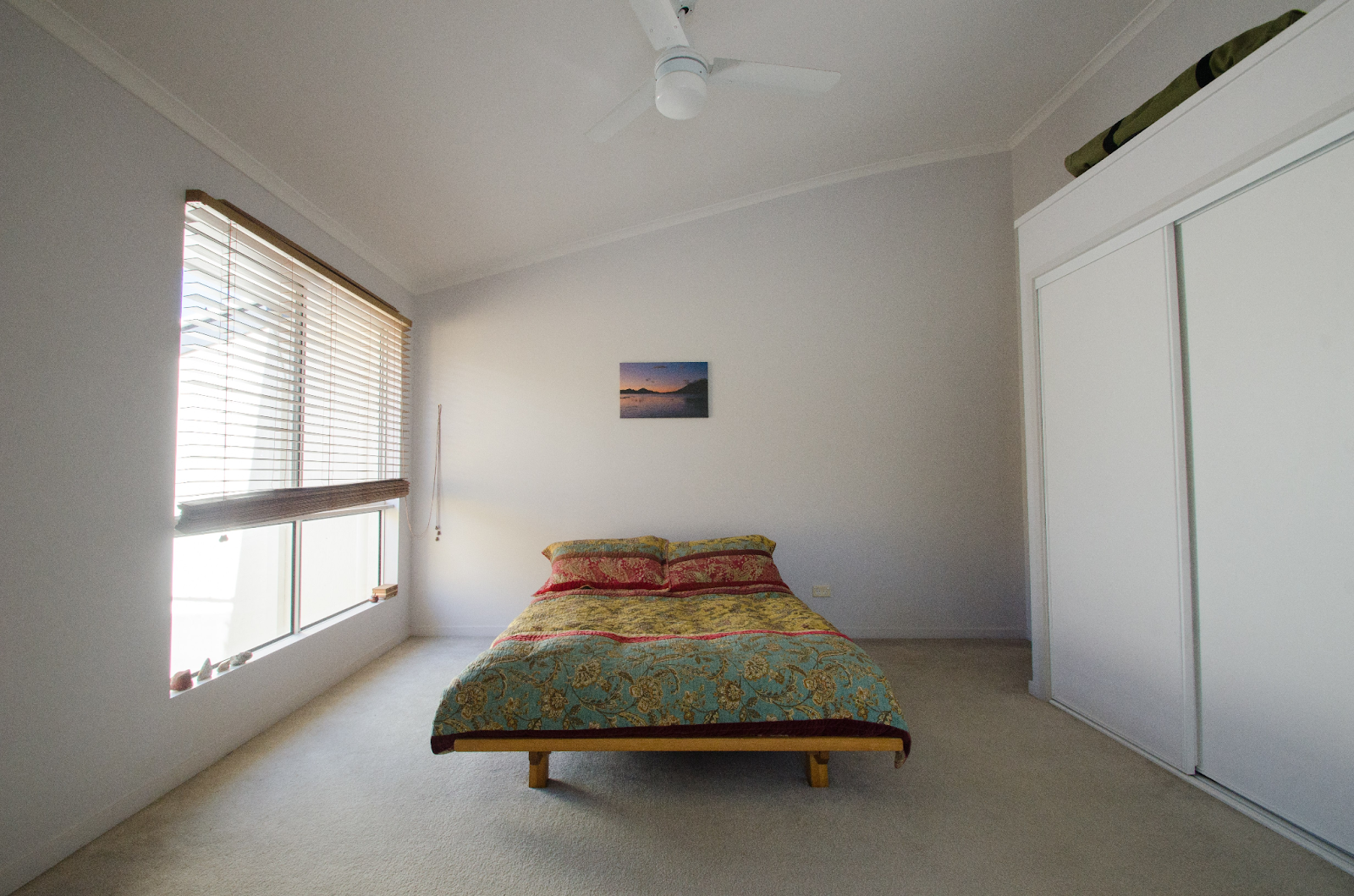 picture showing a bedroom that is barely decorated