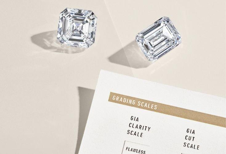 Loose diamonds and a grading scale sheet.