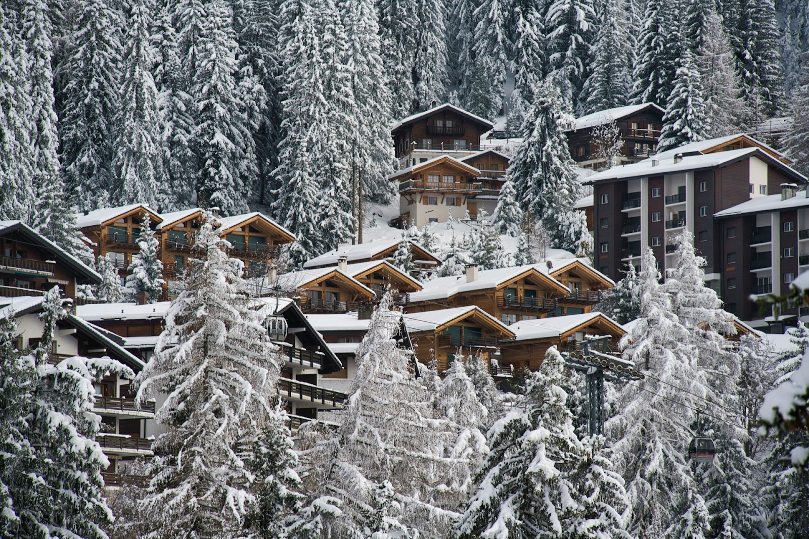 mountain chalets covered in snow