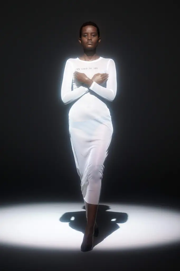 Picture of lady rocking a white sheer fabric  for  dressed undressed brand