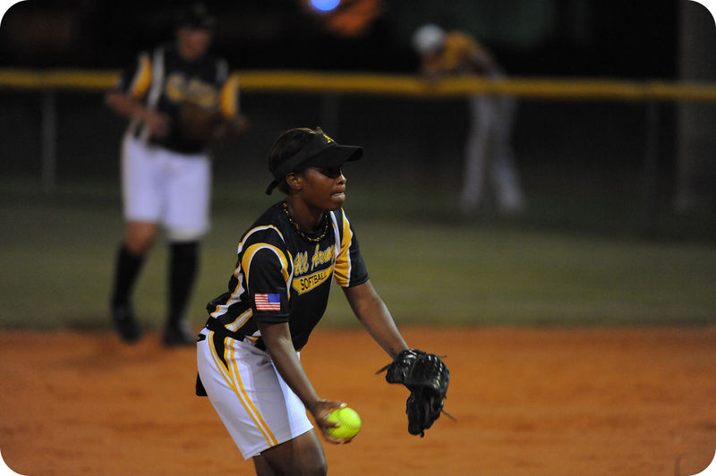 Pitcher in fast pitch softball to demonstrate speed