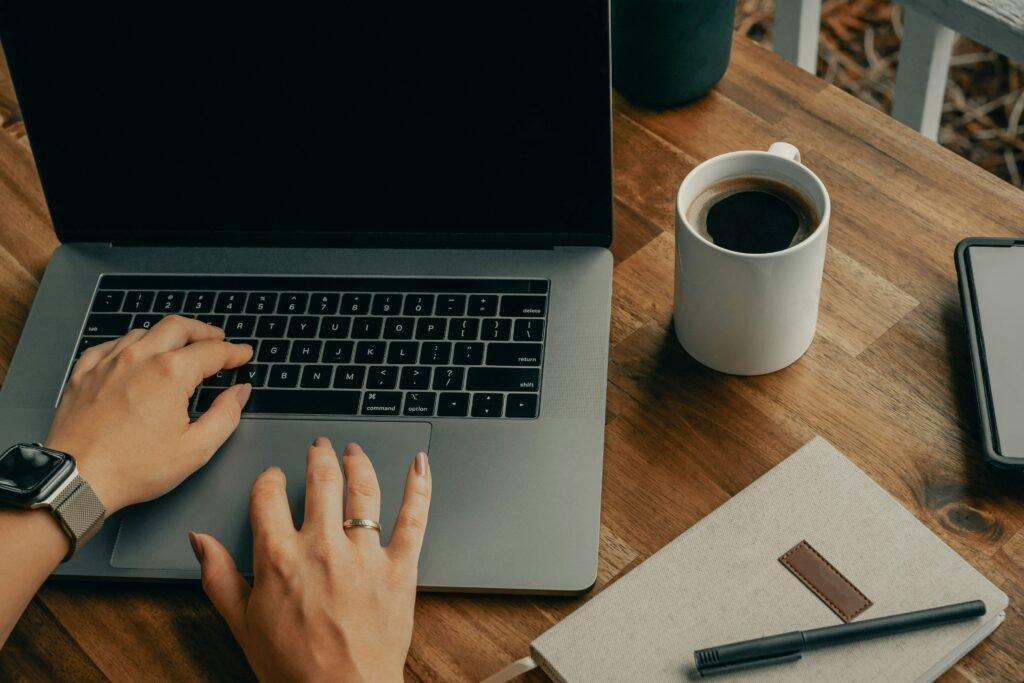 person on laptop with notes - Best Flashcard App