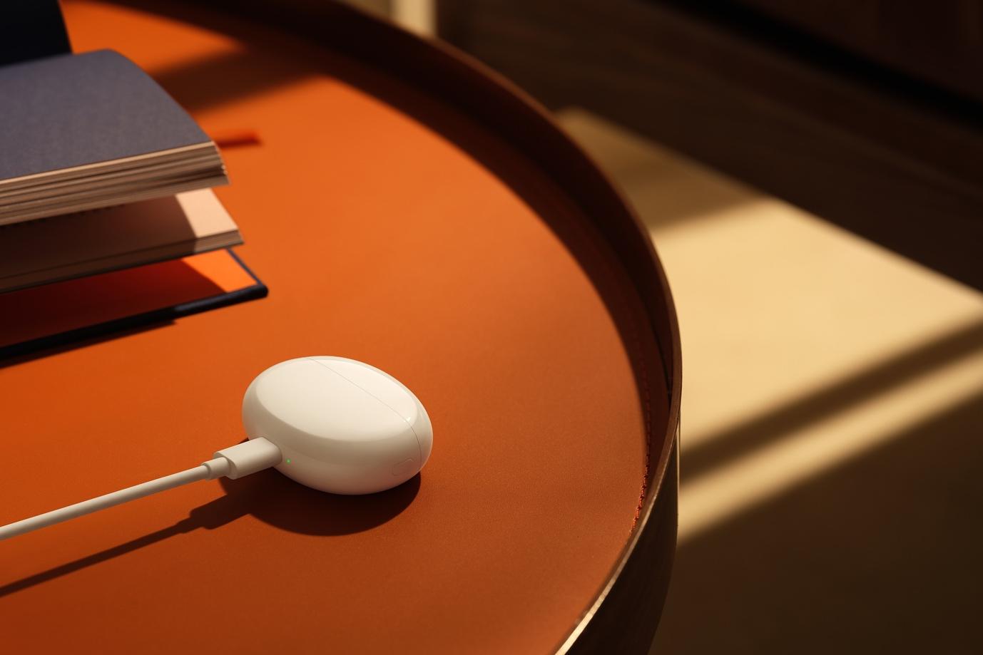 A white earbud on a table

Description automatically generated