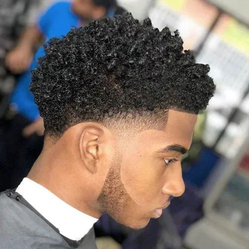 Side view showing a guy with a stylish temp fade 