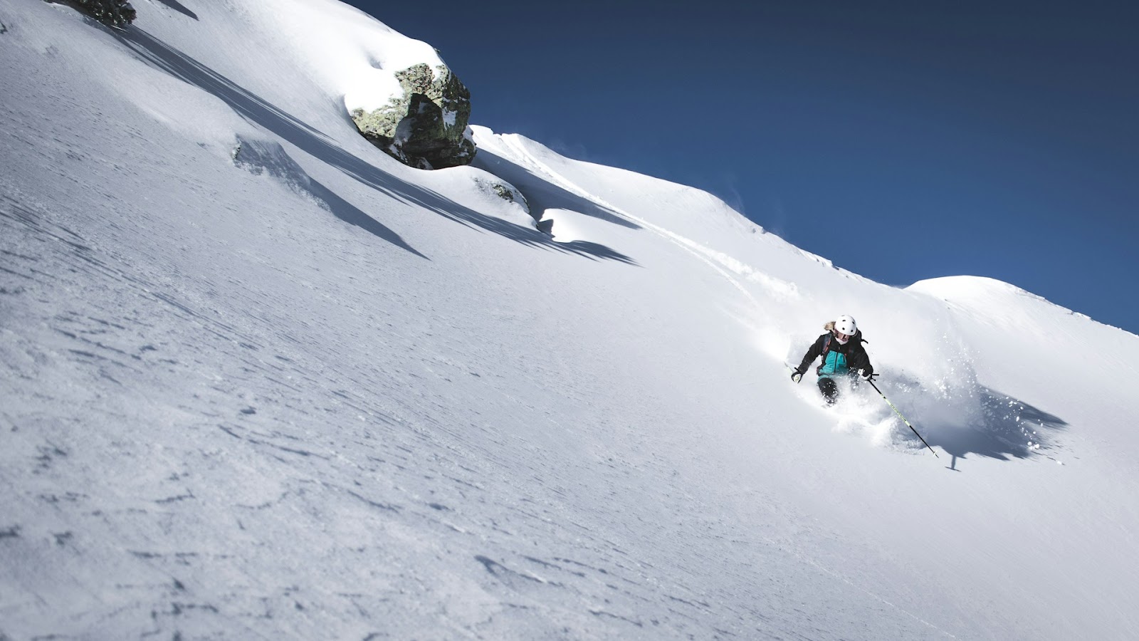 a skier descending down a slope