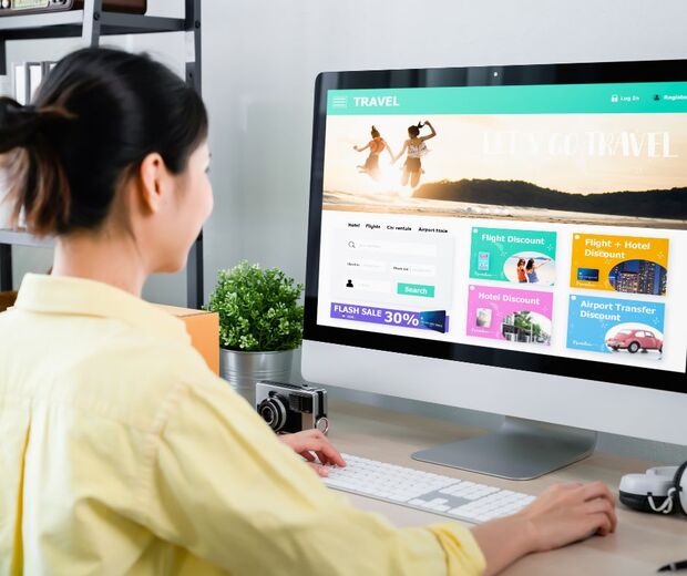 a lady staring at a travel website screen