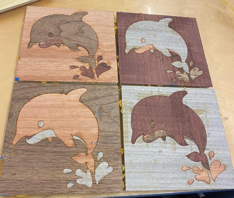 The four blocks arranged close together, their colors muted without stain.