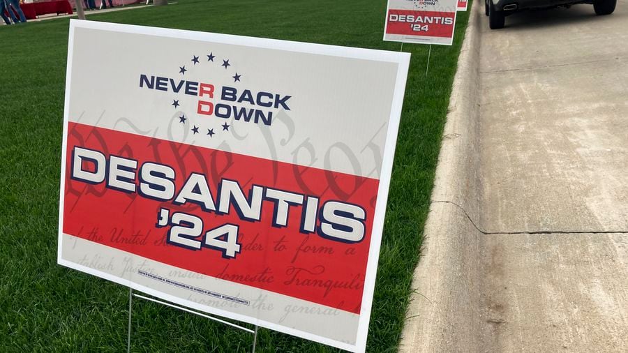 Yard signs promoting Florida Gov. Ron DeSantis in 2024, financed by the super PAC promoting DeSantis for president, line the street leading up to a Republican congressional fundraiser on May 13 in Sioux Center, Iowa.