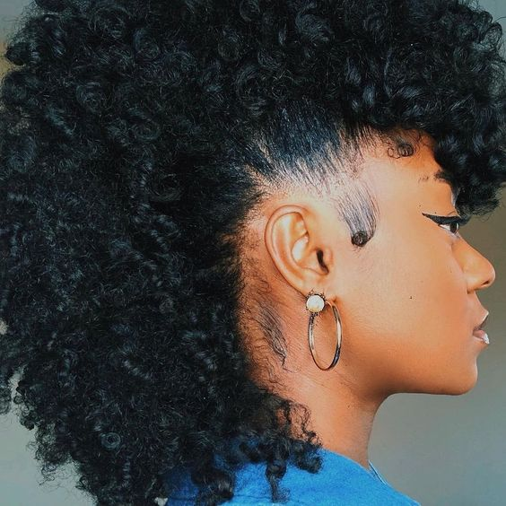 Picture of a lady rocking the curly mohawk style