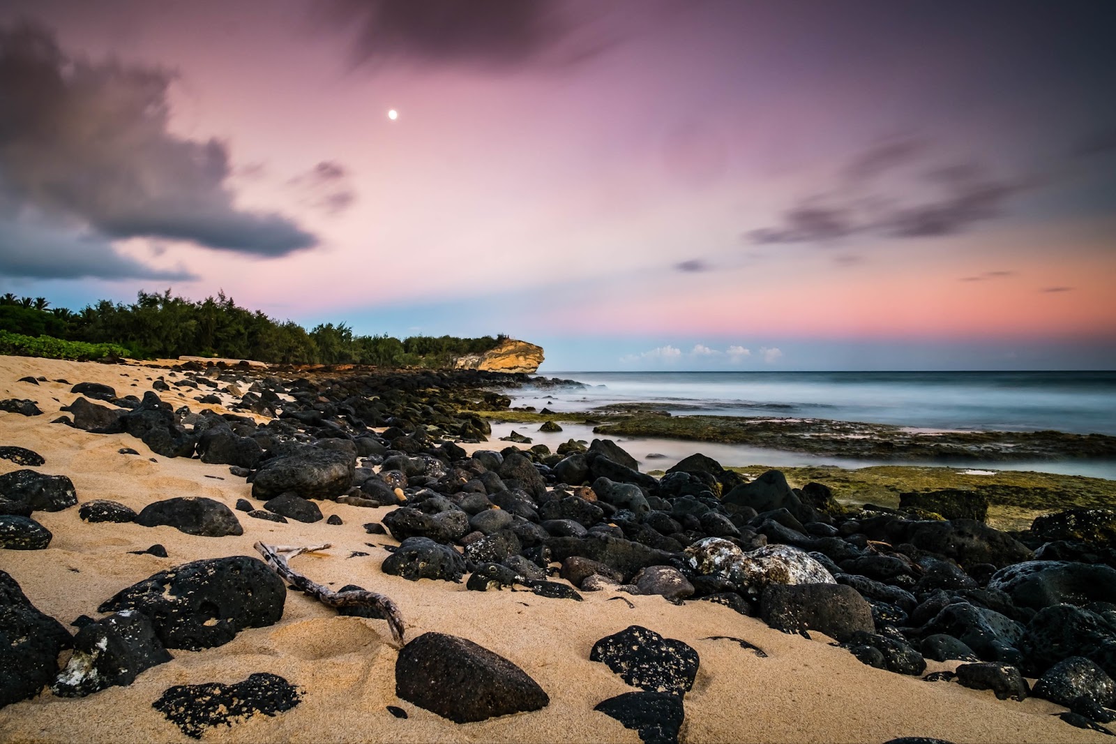 Awe-inspiring volcanic rock formations meeting the ocean in Hawaii.