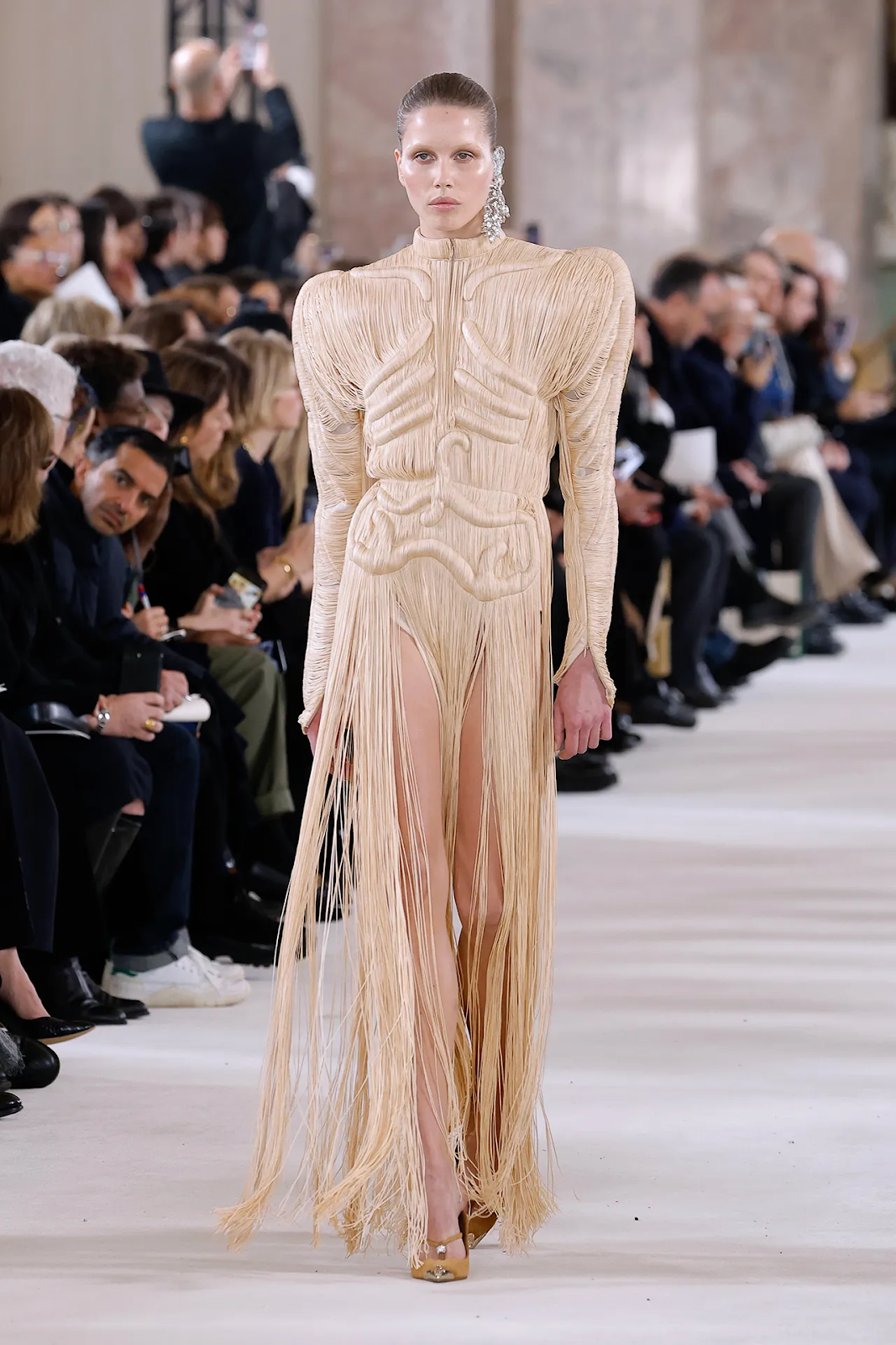 Picture showing a model in a gorgeous design for the Schiaparelli show